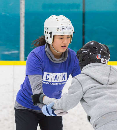 Skate staff supporting child with autism