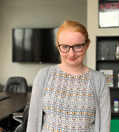 A young adult woman in an office